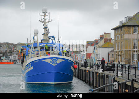 Weymouth, Dorset. 27th November 2018. The 19m twin-rig freezer prawn trawler, MV Nereus, berths in Weymouth harbour after a night spent fishing at sea in atrocious weather Credit: stuart fretwell/Alamy Live News