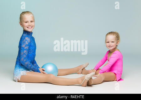 Cute sporty sisters posing looking at camera Stock Photo