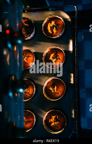 Cooked muffin are taken out from the oven Stock Photo