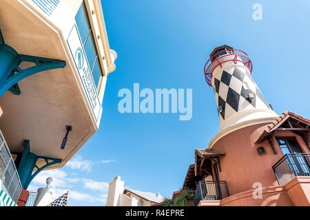 Destin, USA - April 24, 2018: City town village Pirate's Alley looking up low angle on Harbor Boardwalk, lighthouse, in Florida panhandle gulf of mexi Stock Photo