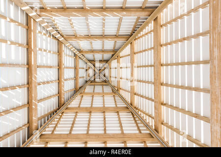 Looking up abstract low angle of wooden pavilion tower roof ceiling closeup by beach ocean gazebo in Florida, architecture, view Stock Photo