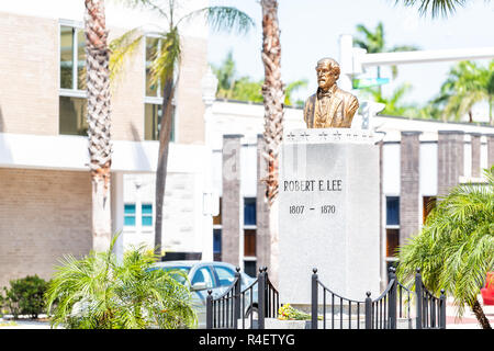 Fort Myers, USA - April 29, 2018: City town street during sunny day in Florida gulf of mexico coast, Robert E Lee statue memorial bust sculpture Stock Photo