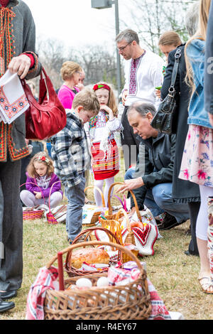 Washington DC, USA - April 1, 2018: People, children, dressed in traditional clothes outside, outdoors, Easter baskets for blessing at Ukrainian Catho Stock Photo