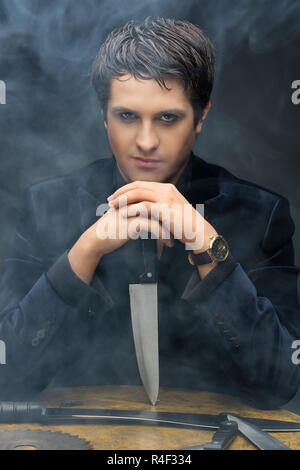 Man with knives Stock Photo