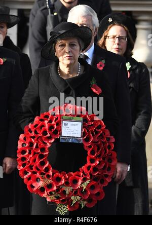 11/11/2018. London, United Kingdom. Remembrance Sunday and the Centenary of the Armistice. Theresa May and Jeremy Corbyn join the Queen Elizabeth II accompanied by members of the  Royal family including Prince Charles, Prince of Wales and Camilla, The Duchess of Cornwall,  Prince William, Duke of Cambridge and Catherine, The  Duchess of Cambridge,  Prince Harry, The Duke of Sussex and Meghan, The Duchess of Sussex , attend the Remembrance Sunday service at The Cenotaph in central London on  the Centenary of the end of the First World War.  Picture by Andrew Parsons / Parsons Media Stock Photo