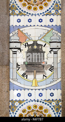 Panel of glazed tiles - azulejos -  from the early twentieth century constant in railway station of S. Bento  in Porto, Portugal, representing a steam Stock Photo