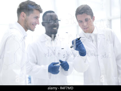 promising scientist makes notes on the Board Stock Photo