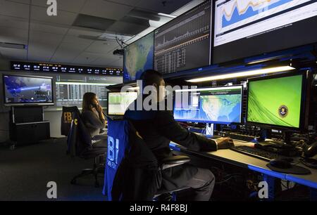 Federal Bureau of Investigation - FBI -agents work at computer in the ...