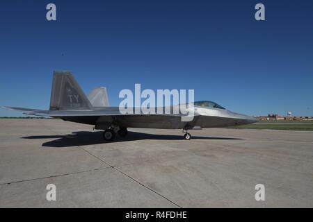 F-22A Raptor of the 325th Fighter Wing, Tyndall Air Force Base, Florida, on the transient ramp May 1, 2017, Tinker AFB, Oklahoma, during a fuel stop. Tinker AFB overhauls the Pratt & Whitney F119 engines used by the U.S Air Force's F-22 Raptor fleet. Stock Photo