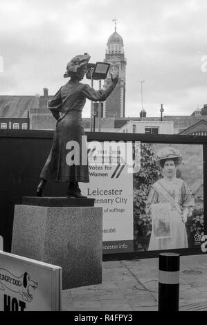 7ft bronze statue of suffragette Alice Hawkins in Leicester City's New Market Square shot on a Pentax K1000 slr camera with Ilford 35mm black and whit Stock Photo
