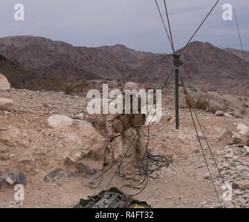 U.S Marine Corps Pfc. Samuel A. Cuzick, radio operator with 1st Battalion, 2nd Marine Regiment (1/2), 2nd Marine Division, executes a mechanized assault course in Twentynine Palms, Calif., Oct. 24, 2016. 1/2 is participating in Integrated Training Exercise (ITX) 1-17 and preparing to support Special Purpose Marine Air-Ground Task Force. Stock Photo