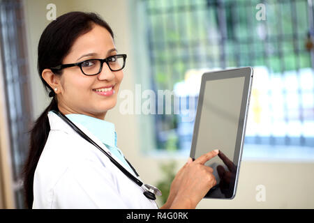 Female doctor using tablet computer Stock Photo