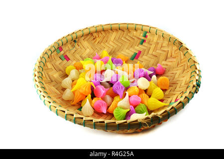 Aalaw candy in basket / colourful candies sweets dessert candy on white background / thai traditional sweet dessert Stock Photo