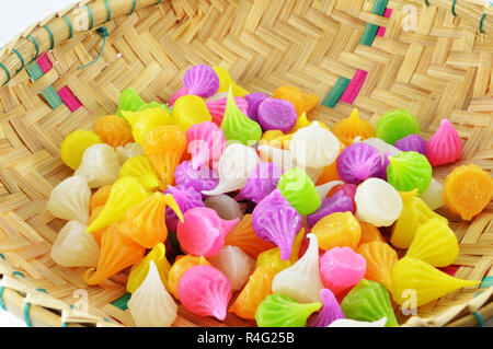 Aalaw candy in basket / colourful candies sweets dessert candy on white background / thai traditional sweet dessert Stock Photo