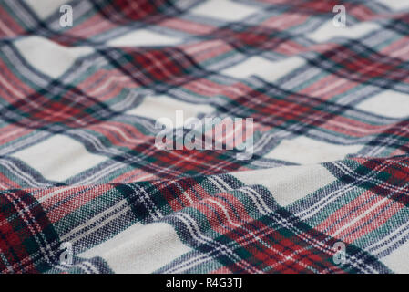 folded creased multicolored checkered woolen fabric background texturr Stock Photo