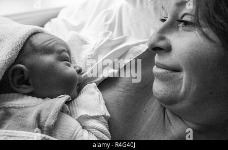 first view of baby after birth to the mother Stock Photo