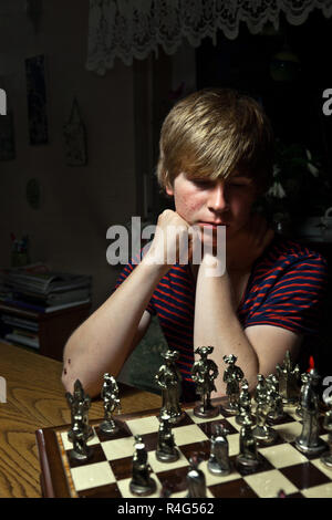 Teenage boy learning to play chess online with tablet computer. Online  education, remote distance learning, entertainment at home Stock Photo -  Alamy