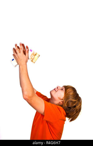 Euros flying around a boys head Stock Photo