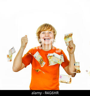Euros flying around a boys head Stock Photo