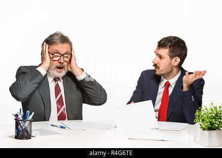 The two colleagues working together at office on white background. Stock Photo