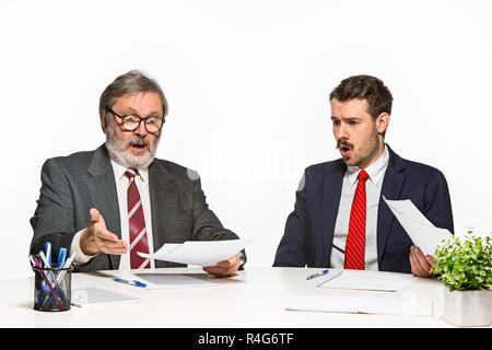 The two colleagues working together at office on white background. Stock Photo