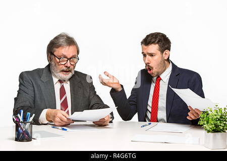 The two colleagues working together at office on white background. Stock Photo