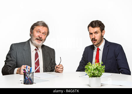 The two colleagues working together at office on white background. Stock Photo