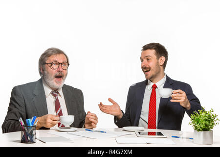 The two colleagues working together at office on white background. Stock Photo