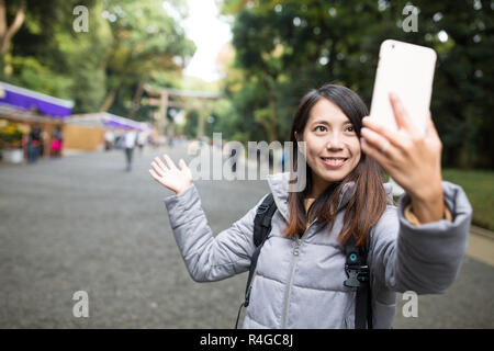 Woman take self photo at Japanese temple Stock Photo