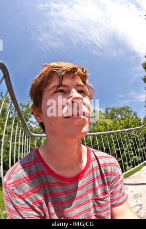 young happy boy sweating and exhausted from sports Stock Photo