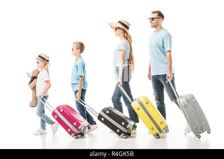 Family walking with colourful luggage isolated on white Stock Photo