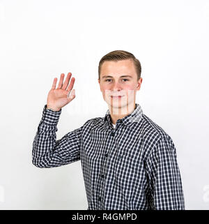 boy greets with his hands Stock Photo