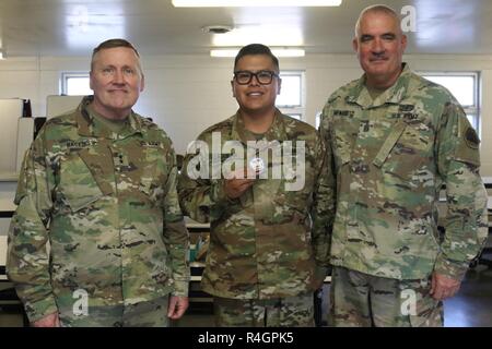 U.S. Army Pfc. Ismael Aguilar, right, a supply technician with ...