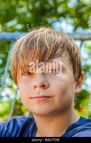 young happy boy sweating and exhausted Stock Photo