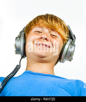 cute handsome boy listening to music by headphones Stock Photo