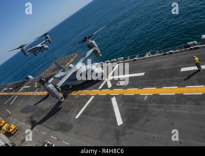 ATLANTIC OCEAN (Oct. 3, 2018) An MV-22B Osprey, attached to Marine Medium Tiltrotor Squadron (VMM) 365 (Reinforced), takes off from the flight deck of the Wasp-class amphibious assault ship USS Iwo Jima (LHD 7) October 3, 2018. Iwo Jima recently departed its homeport of Naval Station Mayport following the completion of a scheduled continuous maintenance availability. Stock Photo