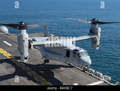 ATLANTIC OCEAN (Oct. 3, 2018) An MV-22B Osprey, attached to Marine Medium Tiltrotor Squadron (VMM) 365 (Reinforced), takes off from the flight deck of the Wasp-class amphibious assault ship USS Iwo Jima (LHD 7) October 3, 2018. Iwo Jima recently departed its homeport of Naval Station Mayport following the completion of a scheduled continuous maintenance availability. Stock Photo