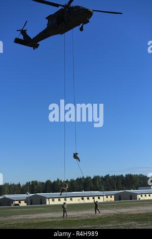 https://l450v.alamy.com/450v/r4h989/soldiers-assigned-to-us-army-europe-units-took-part-in-the-one-week-air-assault-masters-training-course-at-the-grafenwhr-training-area-in-grafenwhr-germany-the-five-day-course-trains-leaders-to-be-able-to-inspect-equipment-prepare-towers-and-aircraft-and-send-people-off-the-tower-or-out-of-an-aircraft-safely-and-efficiently-the-rappel-master-course-is-about-training-leaders-who-have-a-baseline-knowledge-of-repelling-operations-and-expanding-that-knowledge-and-capability-we-take-that-baseline-knowledge-and-we-really-give-them-a-deep-dive-in-how-to-look-at-this-from-a-saf-r4h989.jpg