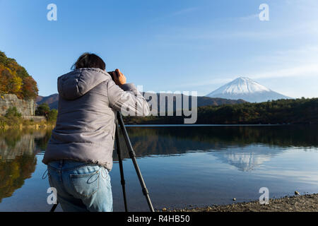 Woman taking photo on Mount Fuji Stock Photo