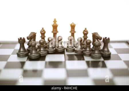 Picture of chess black pawns on the chess board game. Isolated on the white background. Stock Photo