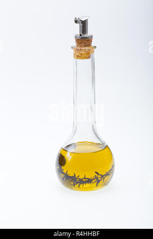 Thyme infused olive oil over white background Stock Photo