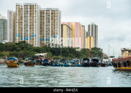 Sampan cruise in Aberdeen harbour, famous for the floating village with old junks and house boats, Hong Kong Stock Photo