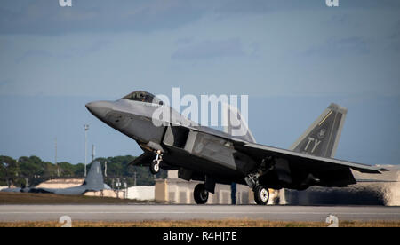 A 325th Fighter Wing F-22A Raptor touches down at Eglin Air Force Base, Fla., Nov. 20.  The first six Raptors arrived to their temporary home at Eglin from Tyndall Air Force Base.  This move is part of mission shift by the Air Force as Hurricane Michael recovery efforts continue at Tyndall.  (U.S. Air Force photo/Samuel King Jr.) Stock Photo