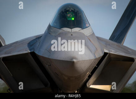 A 325th Fighter Wing F-22A Raptor taxis at Eglin Air Force Base, Fla., Nov. 20.  The first six Raptors arrived to their temporary home at Eglin from Tyndall Air Force Base.  This move is part of mission shift by the Air Force as Hurricane Michael recovery efforts continue at Tyndall.  (U.S. Air Force photo/Samuel King Jr.) Stock Photo