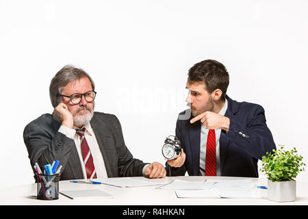 The two colleagues working together at office on white background. Stock Photo