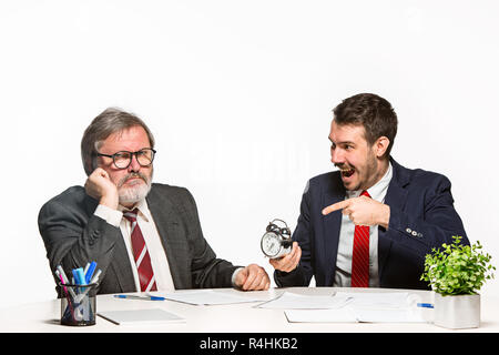 The two colleagues working together at office on white background. Stock Photo