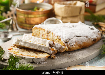 Traditional German stollen, sweet cake with candied fruit and raisins. Christmas sweet gift idea. Selective focus. Stock Photo