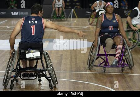 Retired U.S. Air Force Tech Sgt. Ryan Pinney helps set up the line of defense during the 2018 Invictus Games wheelchair basketball match-up against Team New Zealand. The Invictus Games is a Paralympic-style competition featuring 500 athletes from 18 nations, running through Saturday, October 27th. Stock Photo