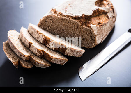 Sliced Bread With Knife Stock Photo