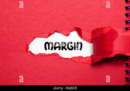Mirgin Paper The word margin appearing behind torn paper Stock Photo - Alamy